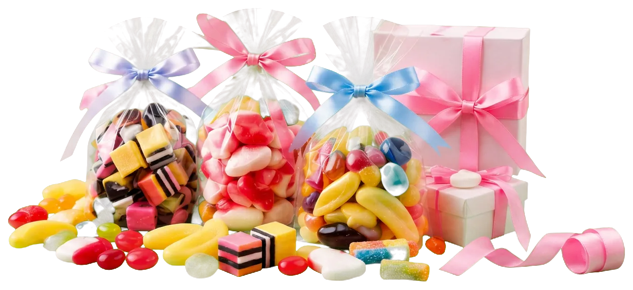 Three cellophane gift bags filled with liquorice allsorts, gummy hearts and jelly beans, tied with lavender-blue, pink and sky-blue bows, beside white gift boxes wrapped in pink satin ribbon, with loose sweets and a curled pink ribbon in front